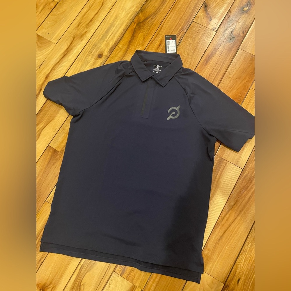 Men’s Peloton Polo Shirt NWT in medium.